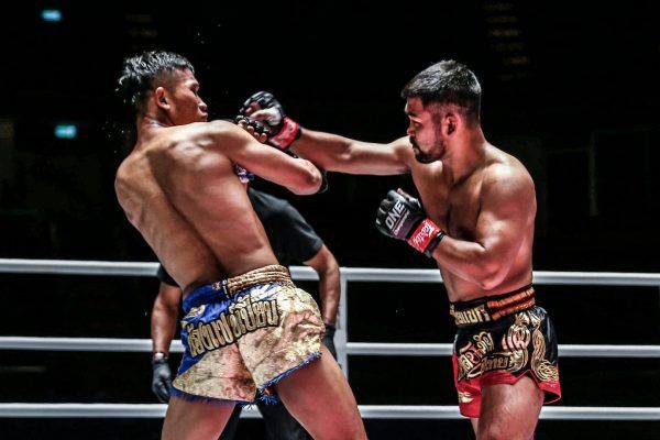 Muay Thai fighter Rodlek PK.Saenchai Muaythaigym lands a left hook on Kulabdam at ONE: A NEW BREED