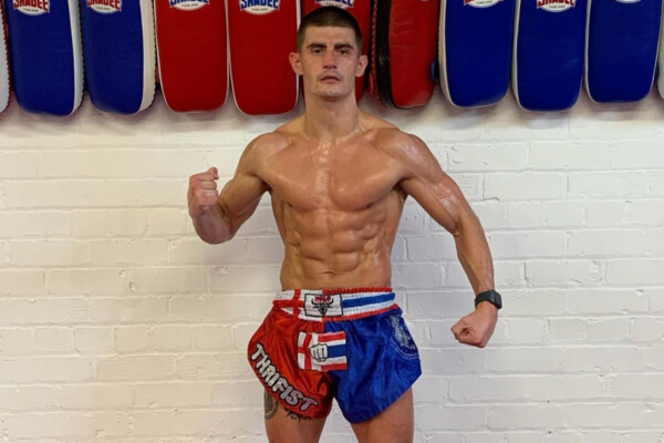 Muay Thai fighter Jacob Smith poses at his gym