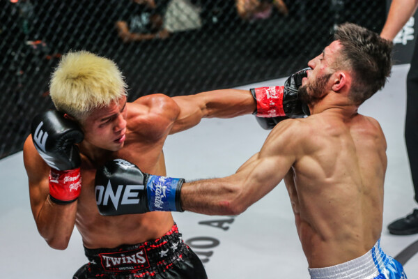 Zhang Peimian throws a left hand on Aslanbek Zikreev