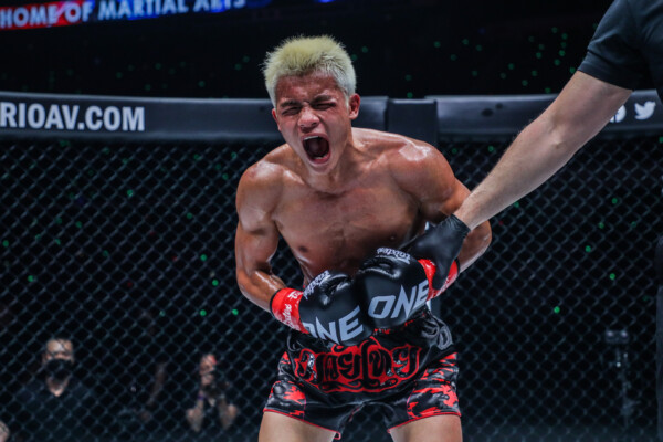Zhang Peimian roars after his win