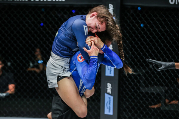 Danielle Kelly applying a rear naked choke on Mariia Molchanova
