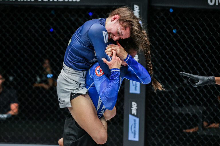 Danielle Kelly applying a rear naked choke on Mariia Molchanova