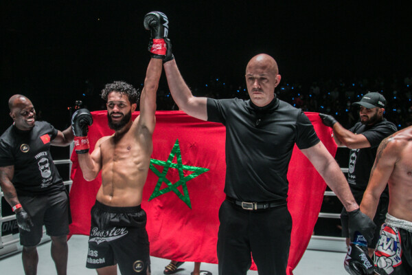 Ilias Ennahachi celebrates his win over Aliasghar Ghosratisaraskan