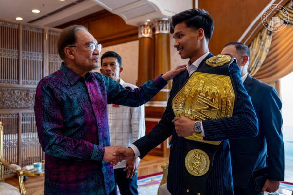 Malaysian Prime Minister Datuk Seri Anwar Ibrahim (L) and Aliff Sor Dechapan (R) at the Prime Minister's Office in Putrajaya, Malaysia.