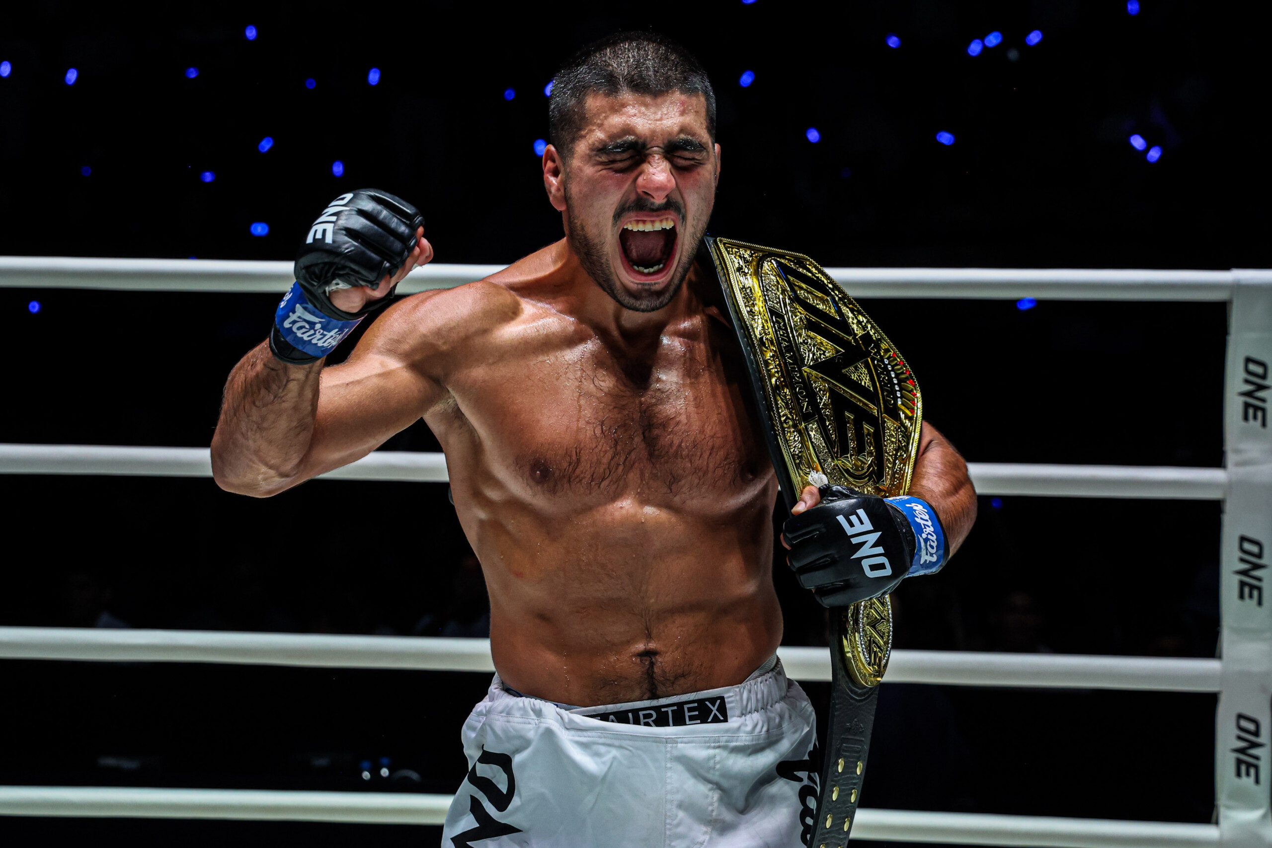 Elbek Alyshov celebrates after capturing the ONE Bantamweight MMA World Championship at The Inner Circle 24.