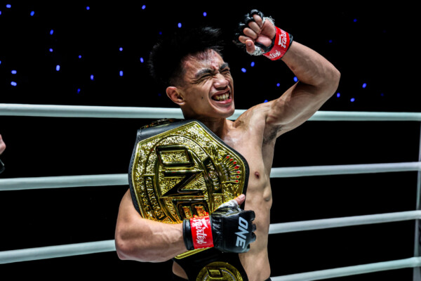 Joshua Pacio celebrates his ONE World Title victory over Mansur Malachiev at The Inner Circle 21