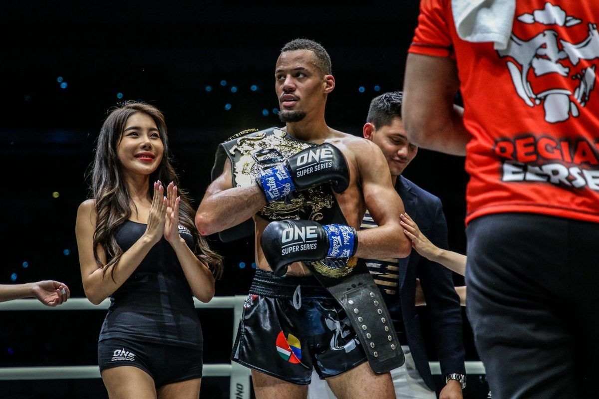 Regian Eersel holds the ONE Lightweight Kickboxing World Title belt