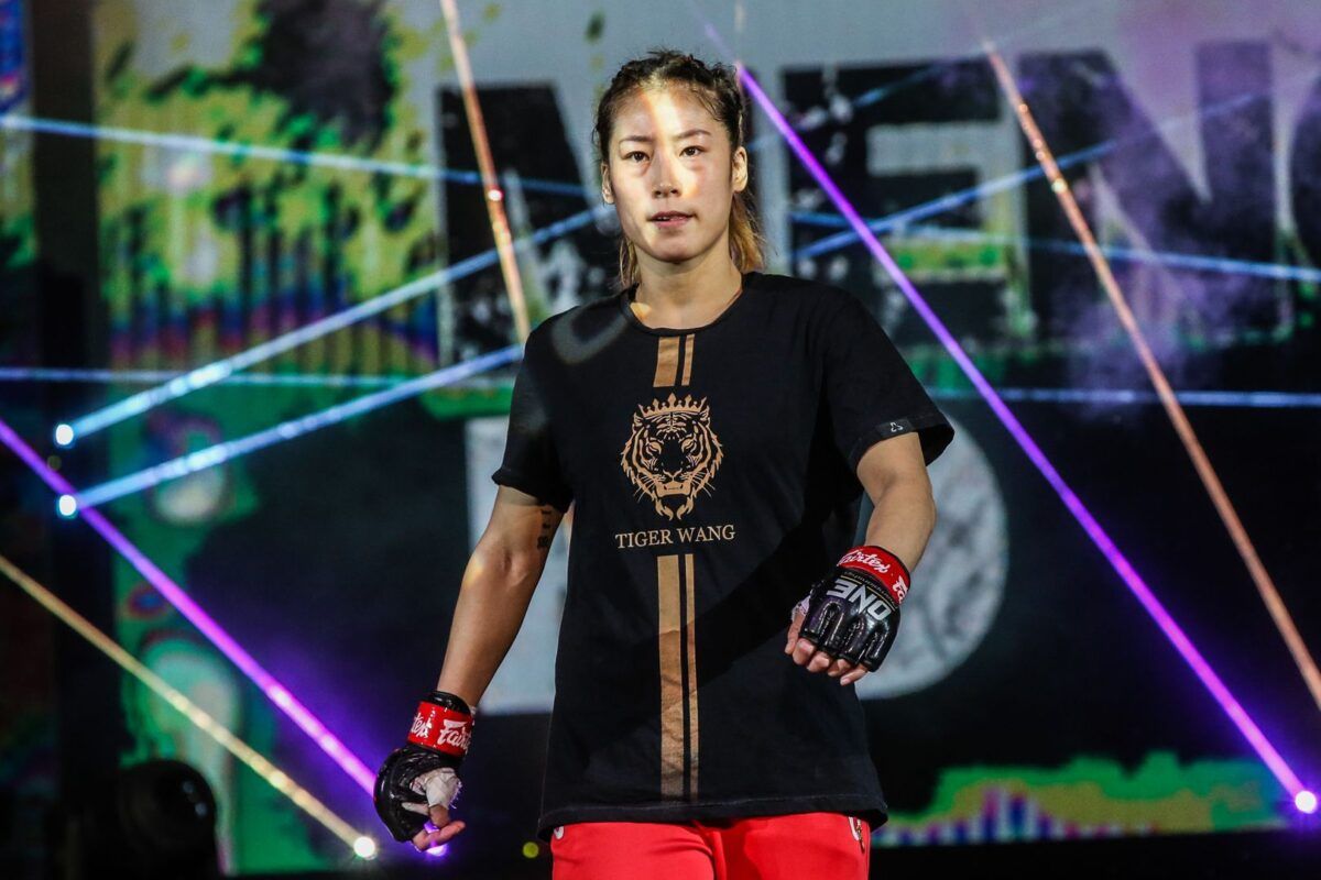 Chinese MMA fighter Meng Bo walks to the cage for her fight