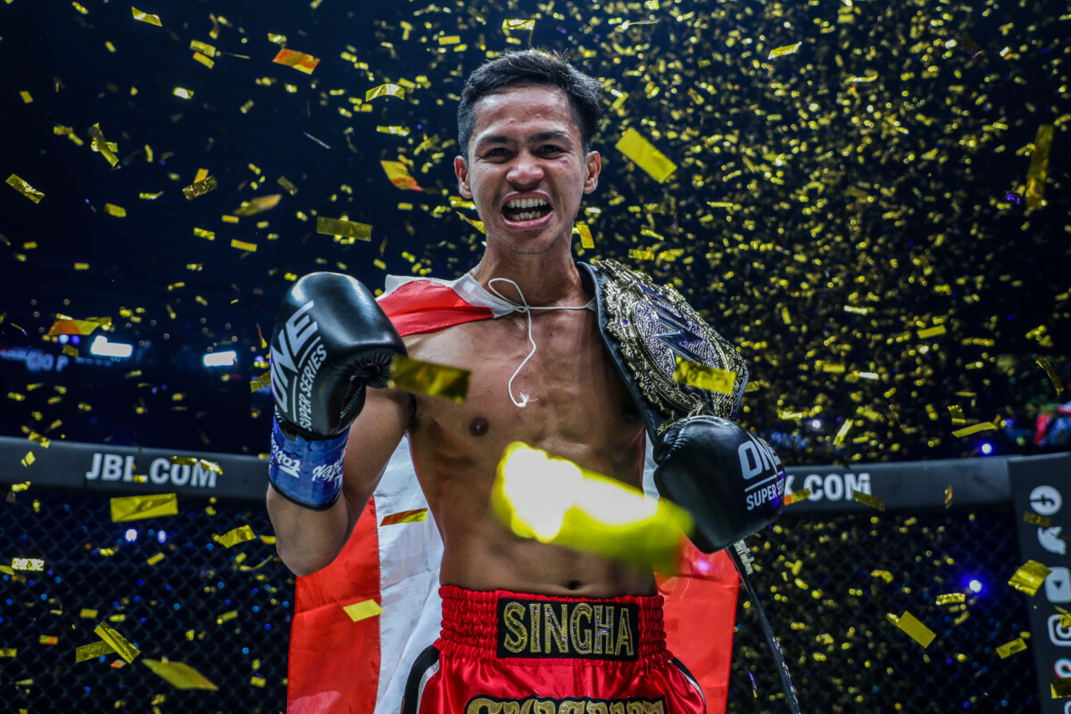 Superbon celebrates as the first-ever ONE Featherweight Kickboxing World Champion.