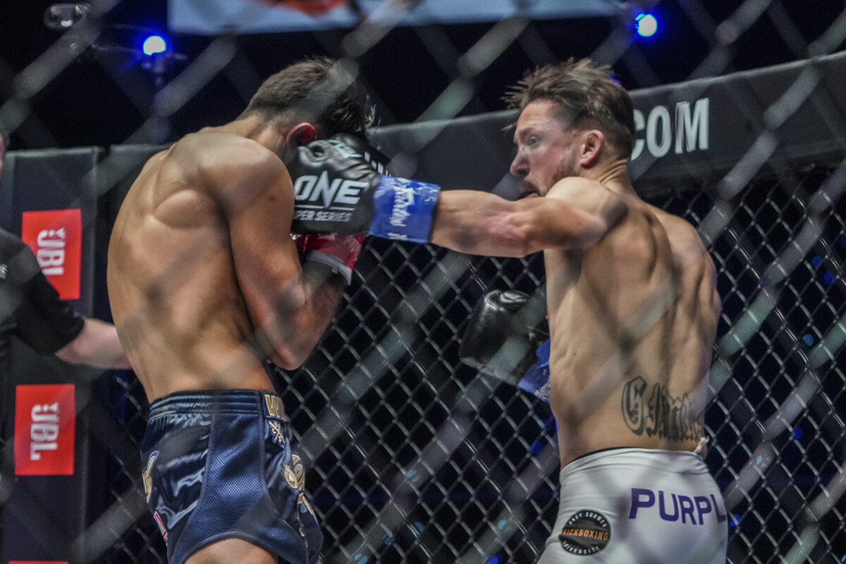 Andy Souwer throws a hook at Marat Grigorian