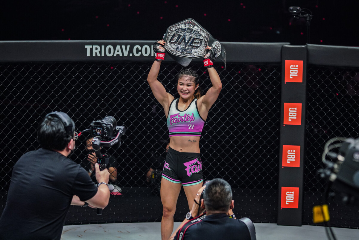 Stamp poses with the ONE Atomweight World Grand Prix title at ONE: WINTER WARRIORS.