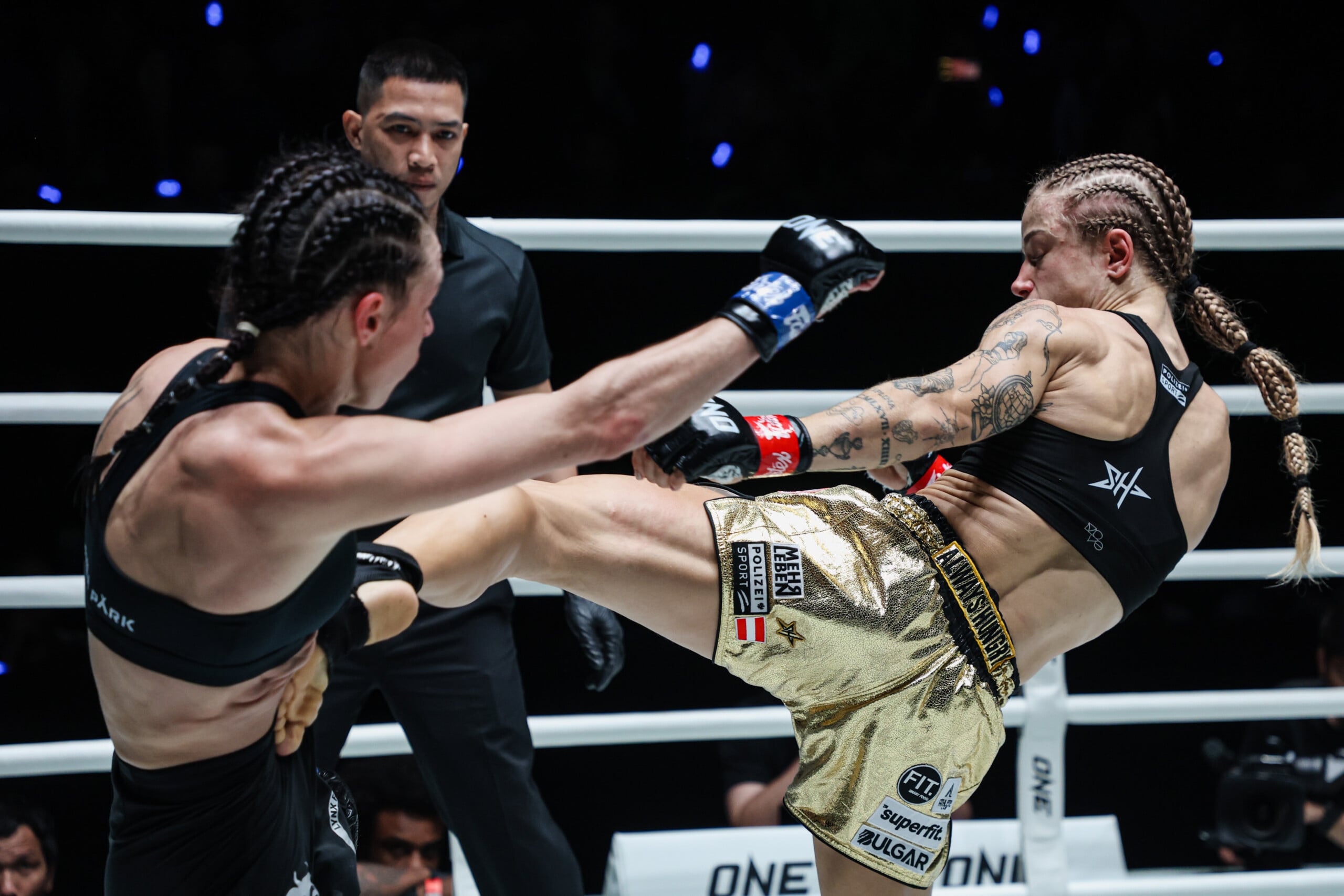 Muay Thai World Champion Stella Hemetsberger kicks Natalia Diachkova in the body
